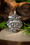 Gnezdovo mask amulet, silvered bronze