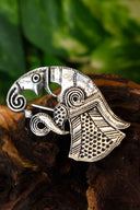 Germanic raven brooch Gotland, left, silvered bronze