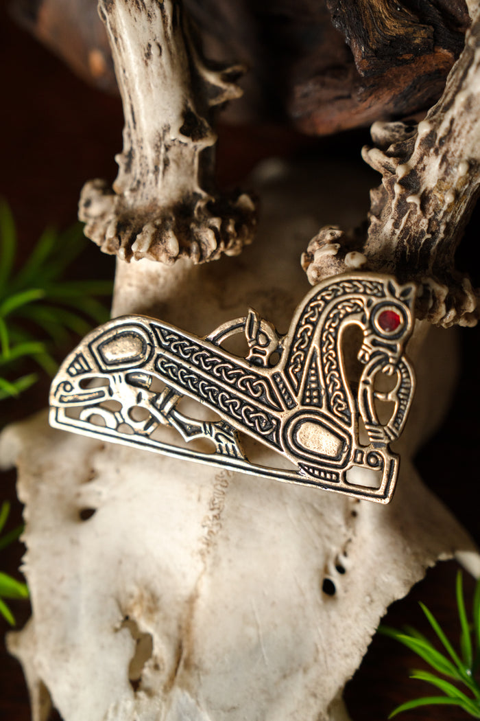 Viking horse brooch, left, bronze