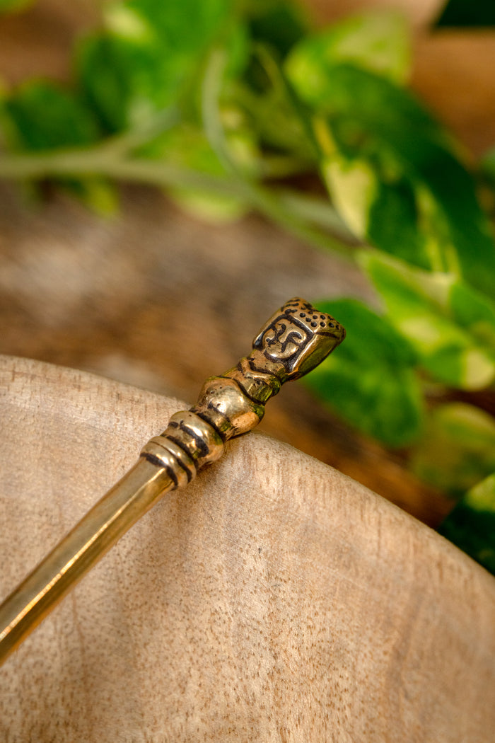 Medieval brass spoon with girls head