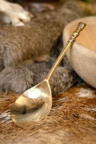 Medieval brass spoon with girls head
