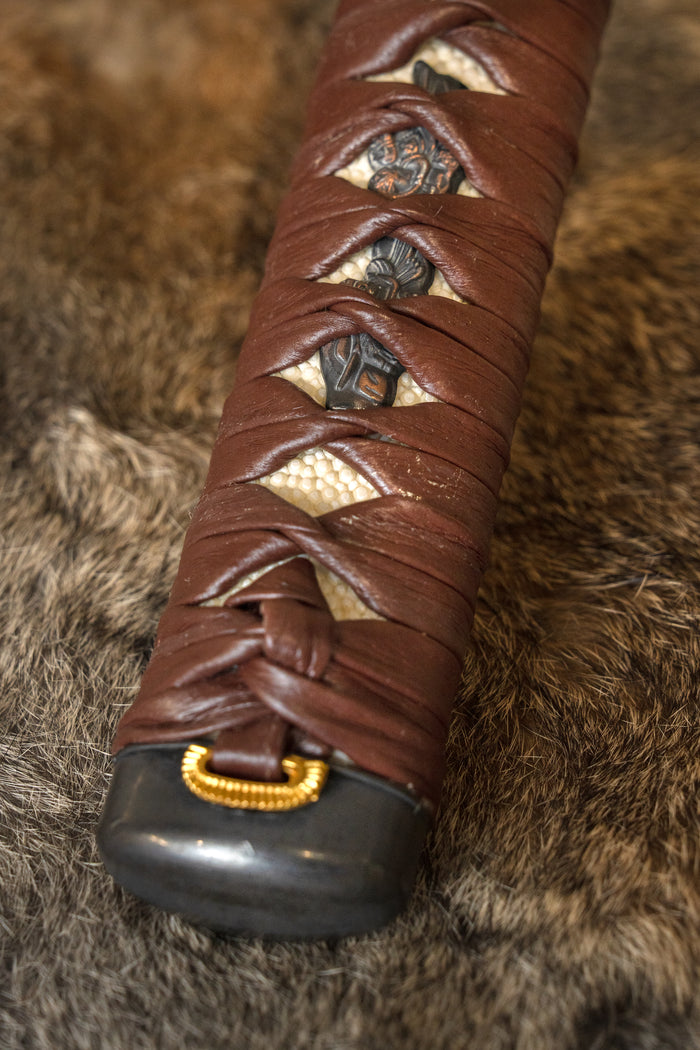 Samurai sword grip with leather wrapping