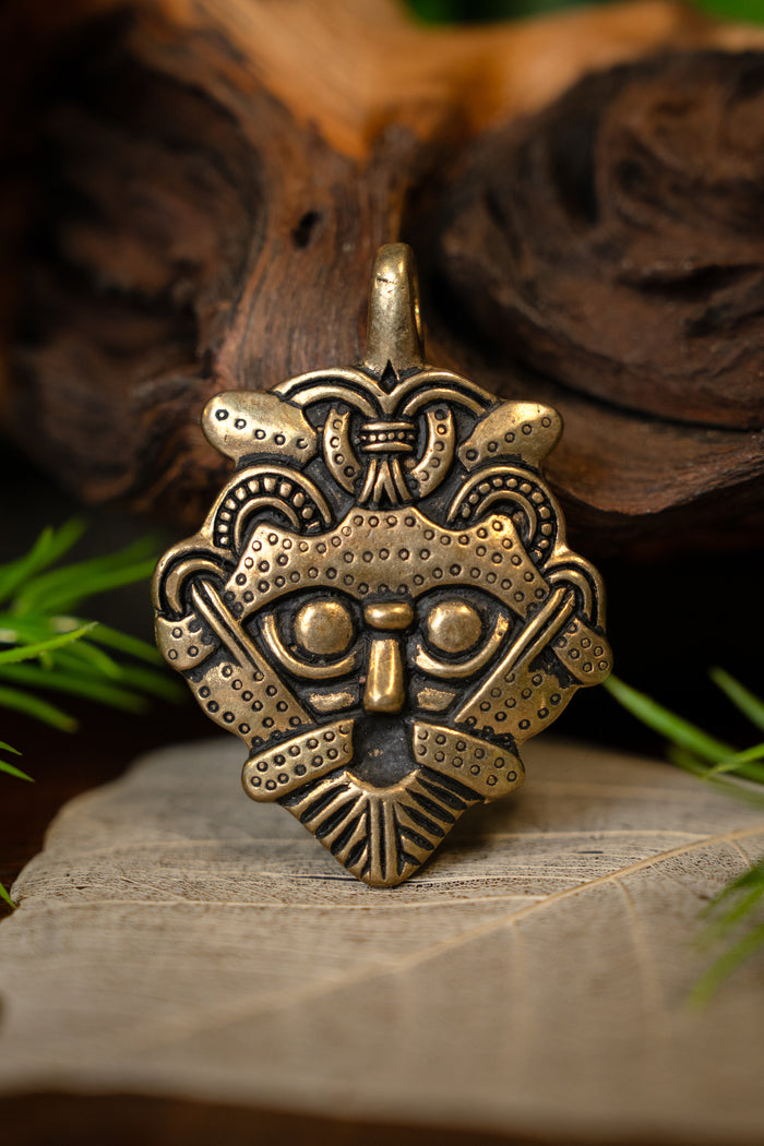 Gnezdovo mask amulet, bronze