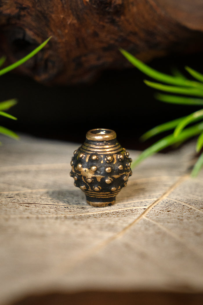 Cuenta de barba vikinga de los siglos IX–X, bronce