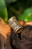 Cylindrisk skäggpärla, brons