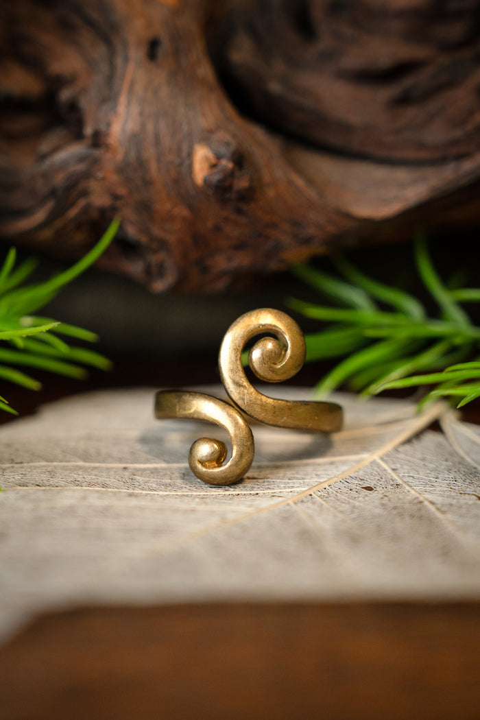 Celtic ring with stylized spiral motif, bronze