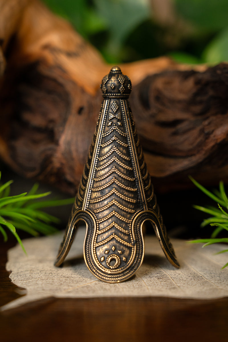 Puntera de gorro Birka, bronce