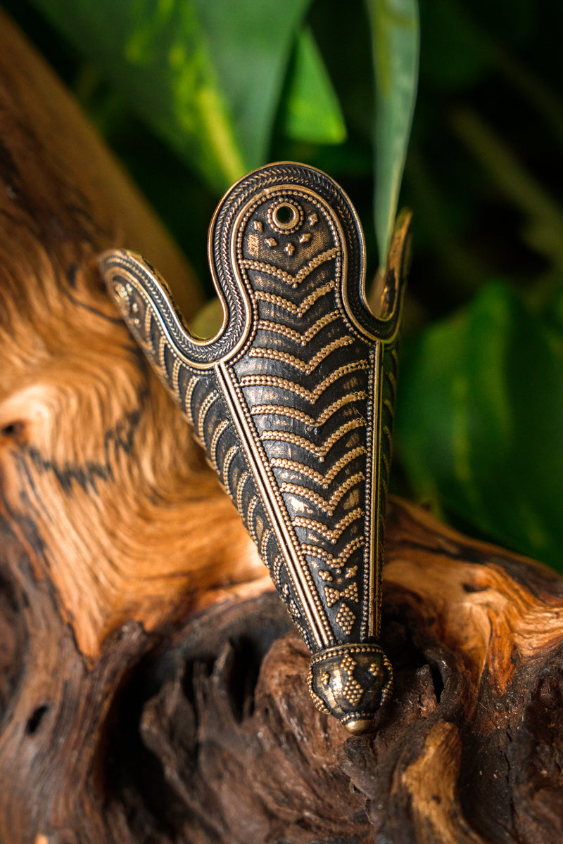 Puntera de gorro Birka, bronce