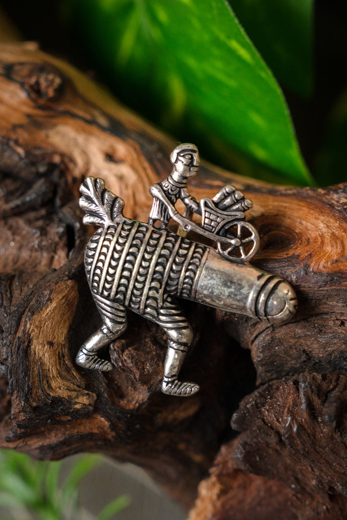 Pilgrim badge phallus with wheelbarrow, silvered bronze