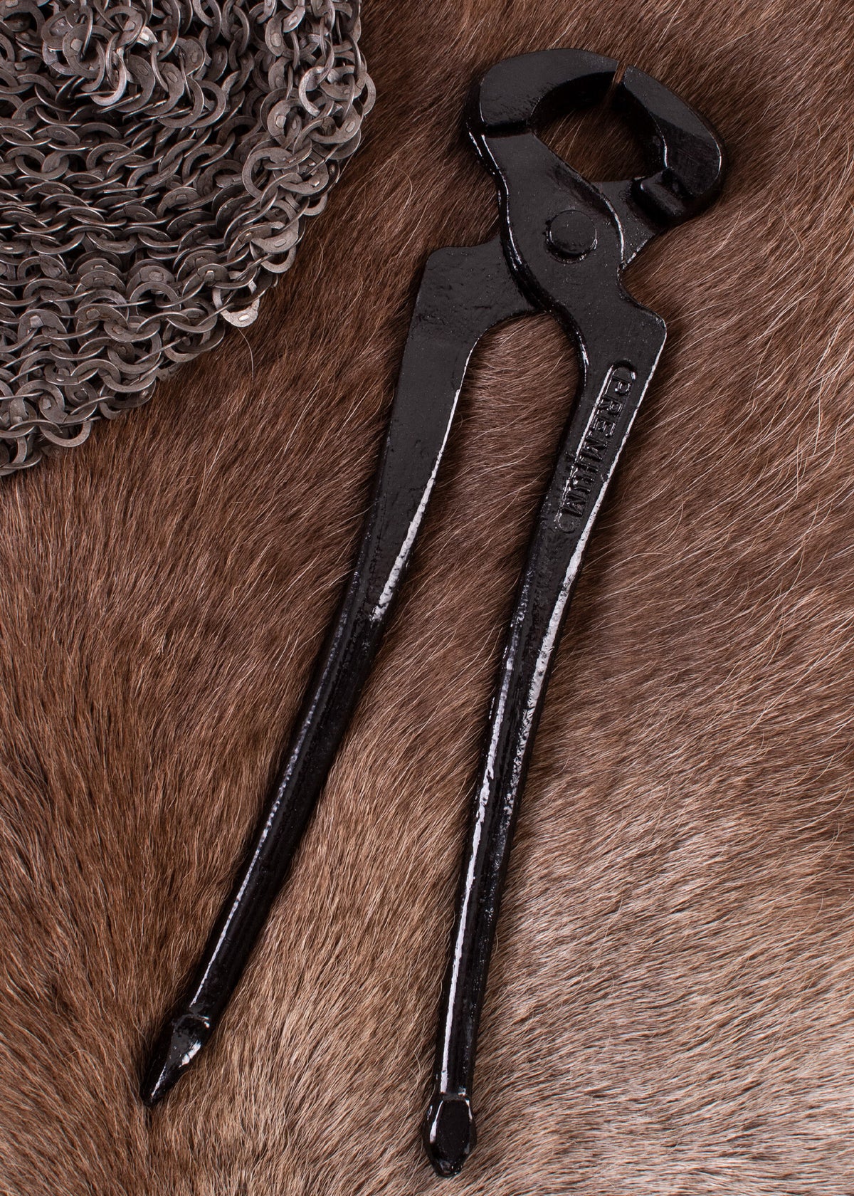 Ringbrynjestång för kilformade nitar