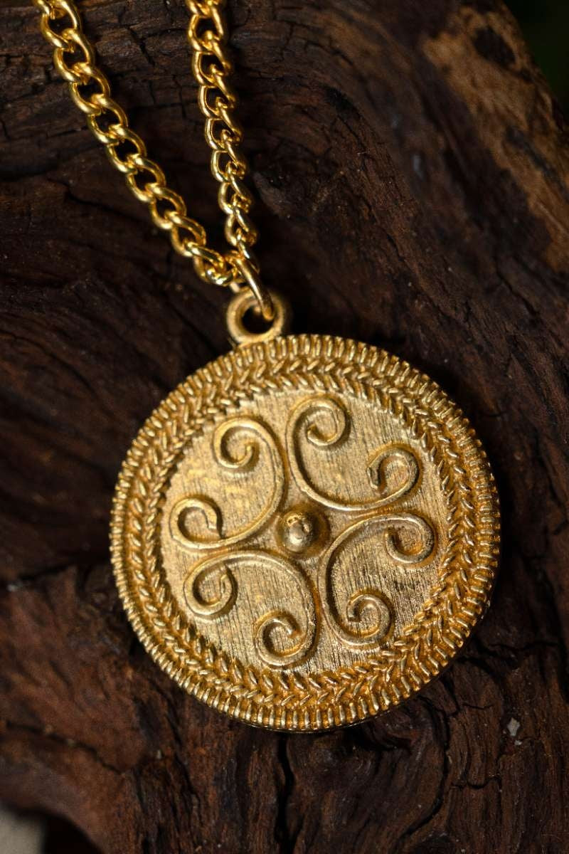 Roman filigree scroll pendant, 2nd-3rd century AD, pewter