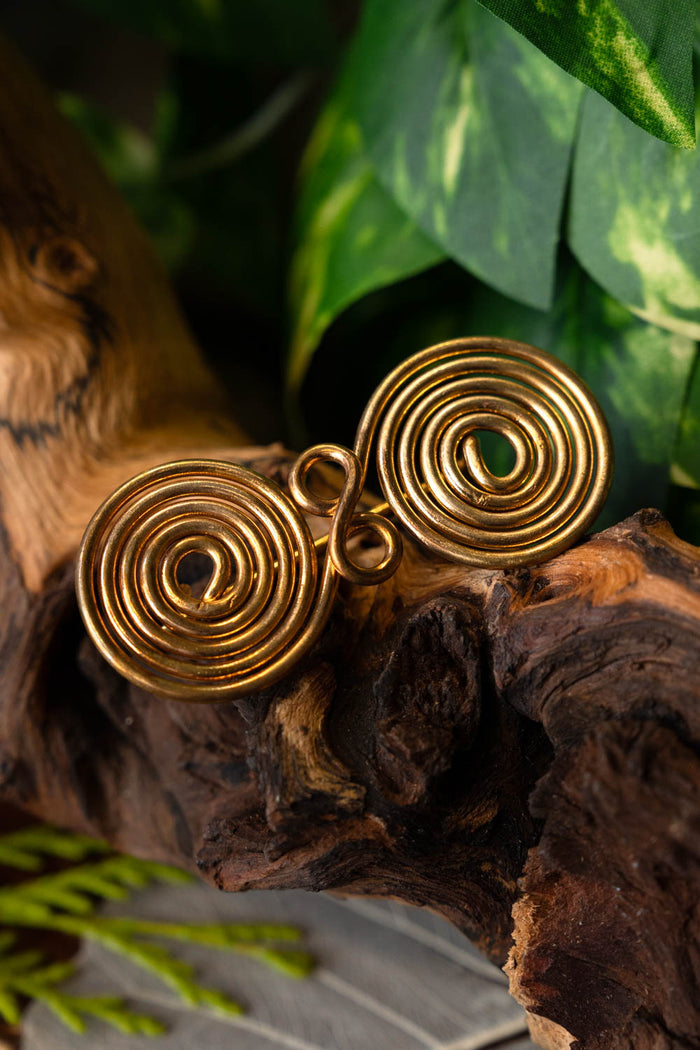 Spiral shaped spectacle fibula, brass