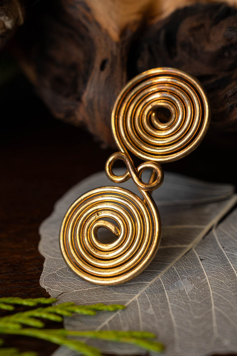 Fibule à lunettes spiralée, laiton