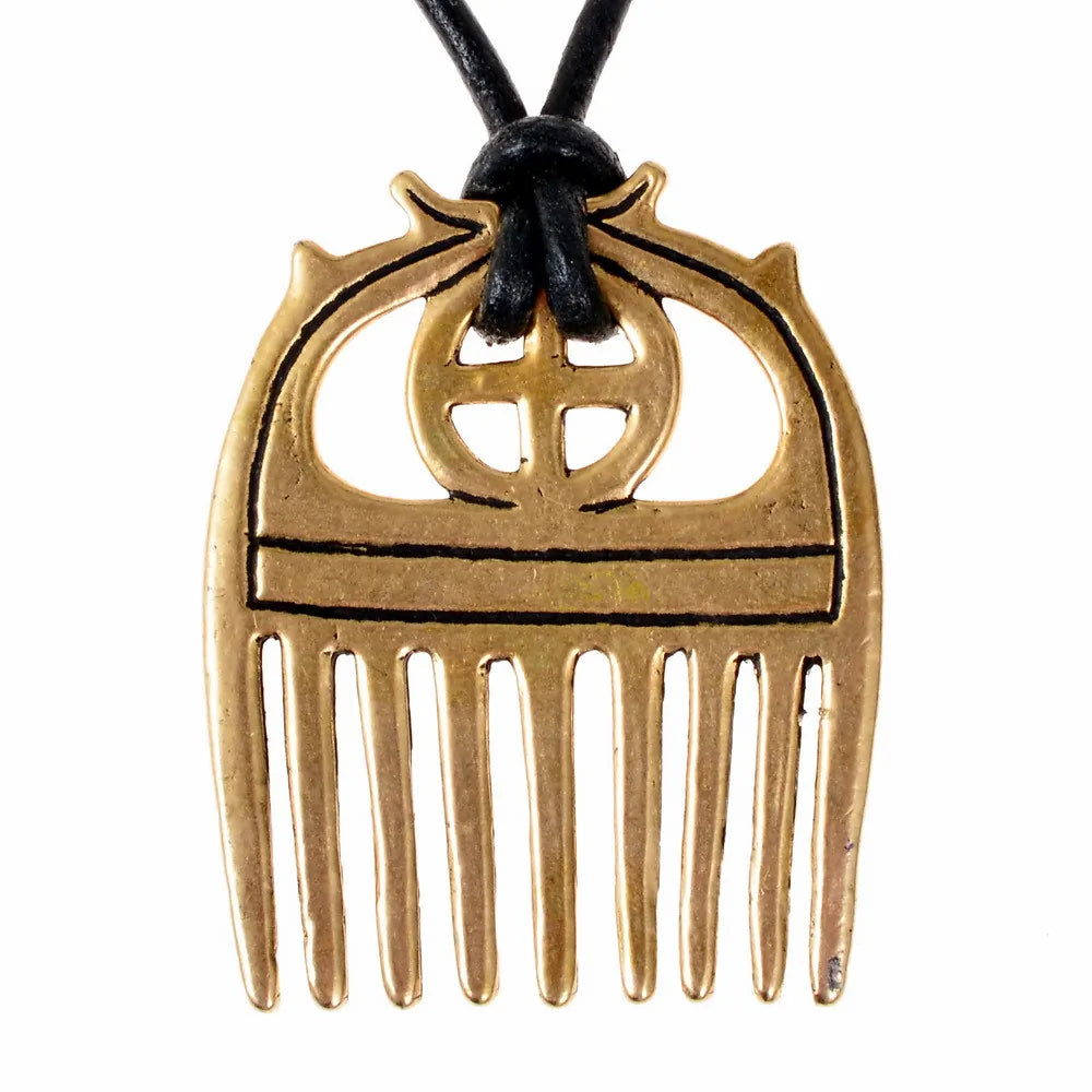 Bronze Age comb with sunwheel, bronze
