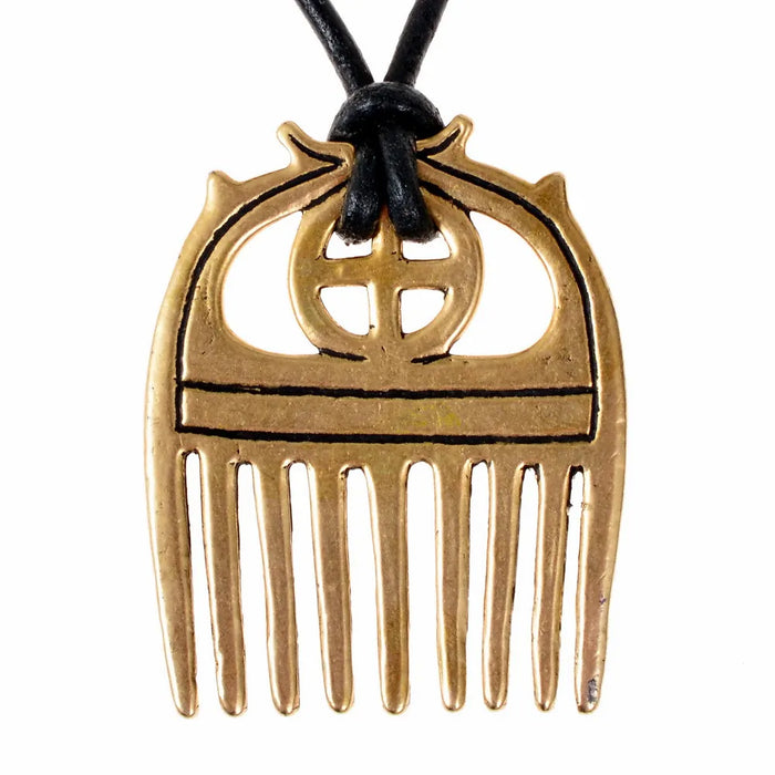 Bronze Age comb with sunwheel, bronze