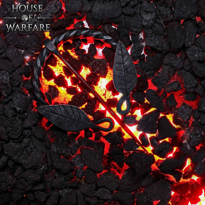 Fibula a ferro di cavallo ritorta con motivo a foglia, ferro