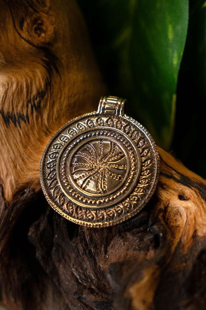 Amulet zonnewiel, brons