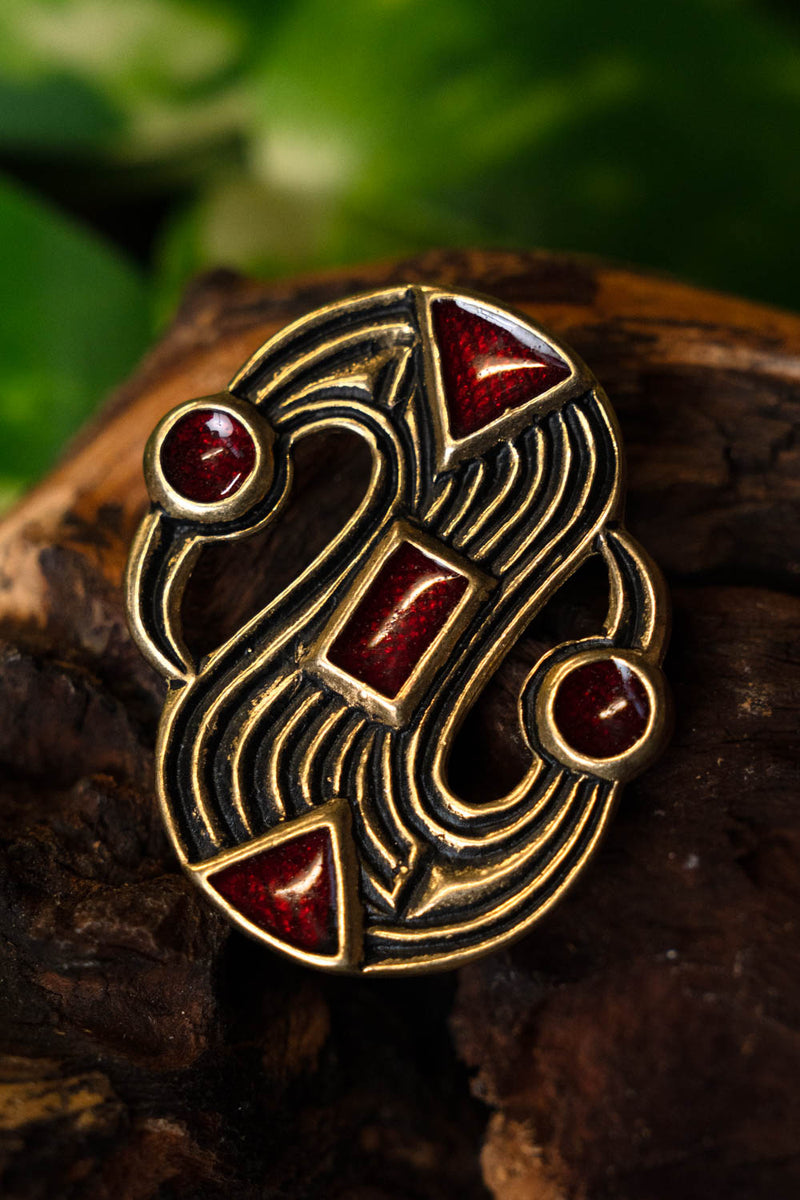 Fibula merovingia a S, bronzo