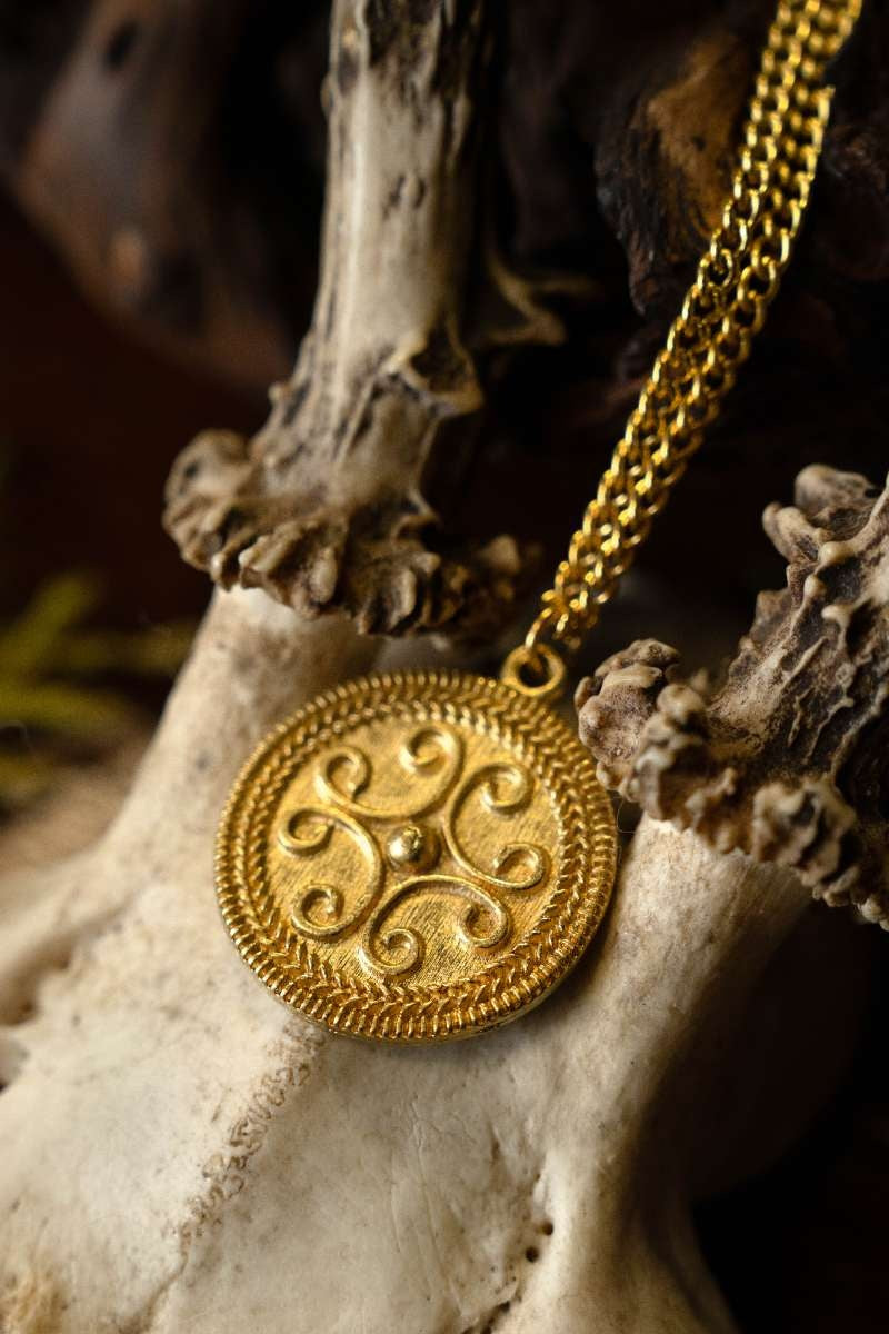 Roman filigree scroll pendant, 2nd-3rd century AD, pewter